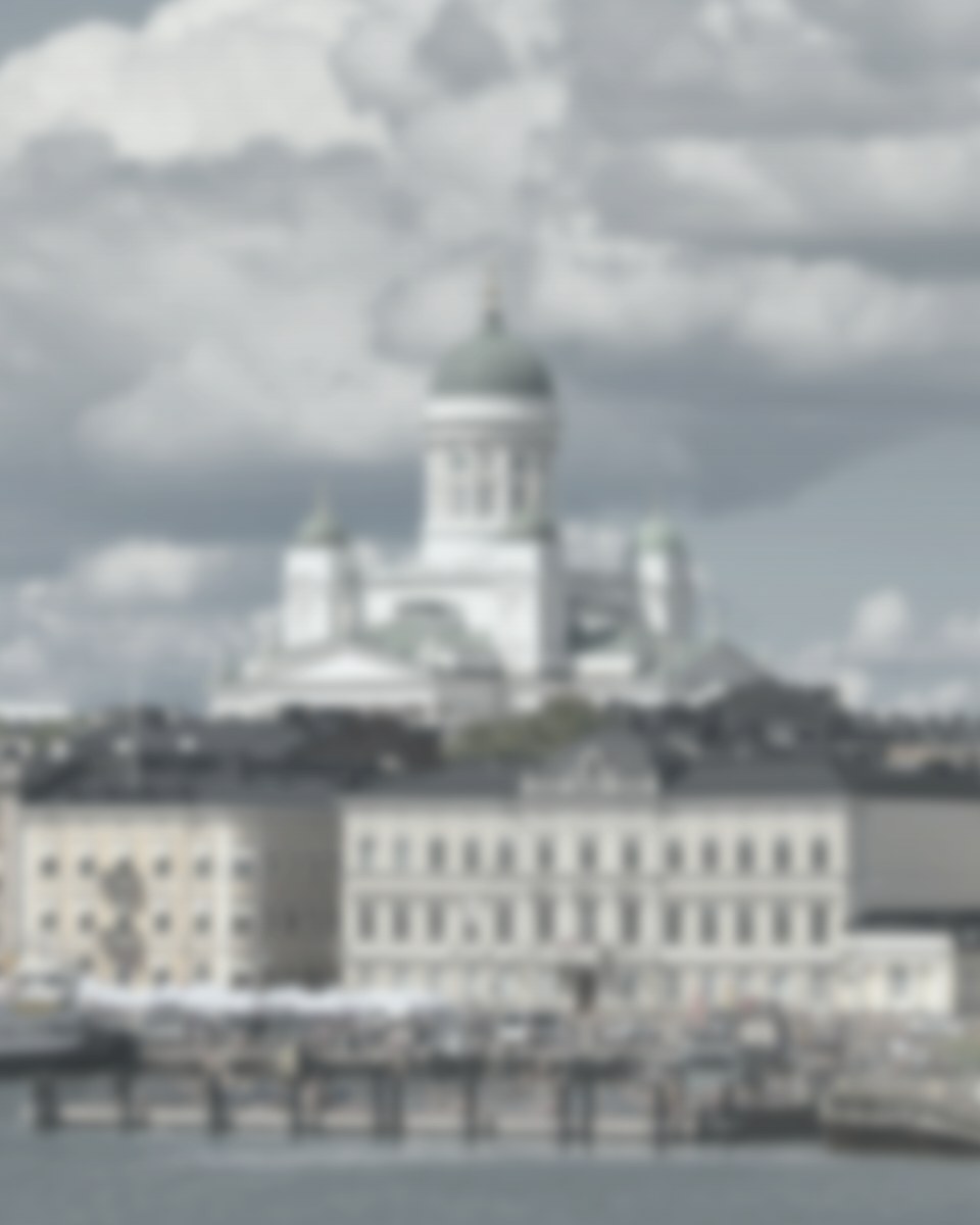 A frosted photograph of Helsinki Cathedral above the harbor.